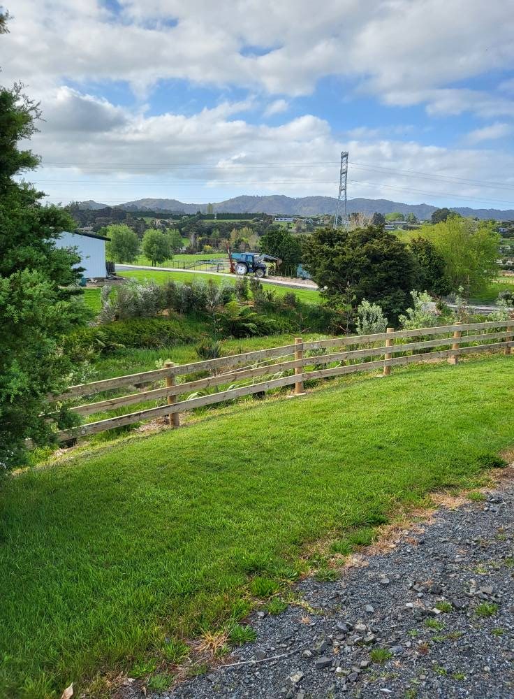 Completed timber fencing installation on a green Northland property