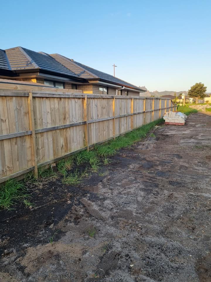 Completed timber boundary fence beside new residential homes