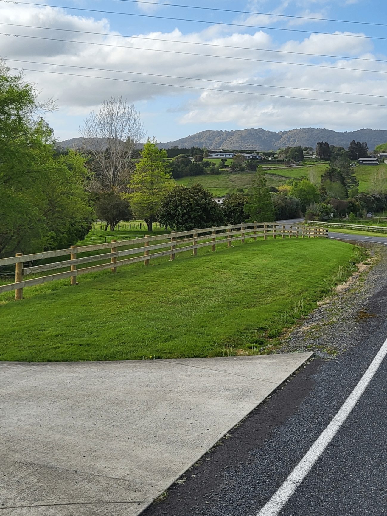 Long completed post and rail fence along a roadside rural property